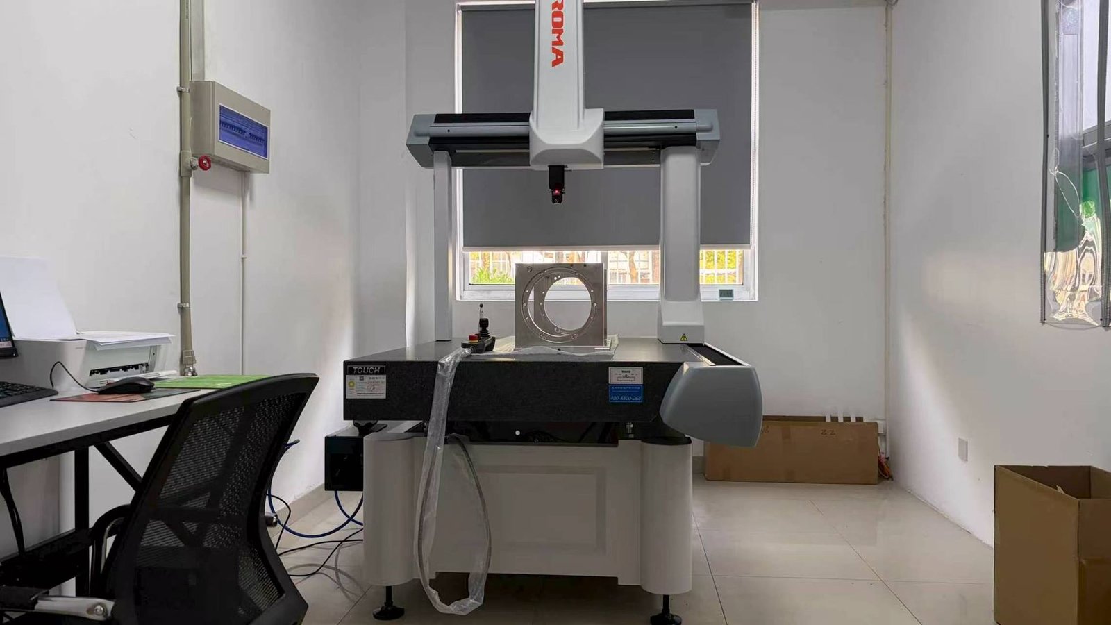 Coordinate measuring machine inspecting a precision part